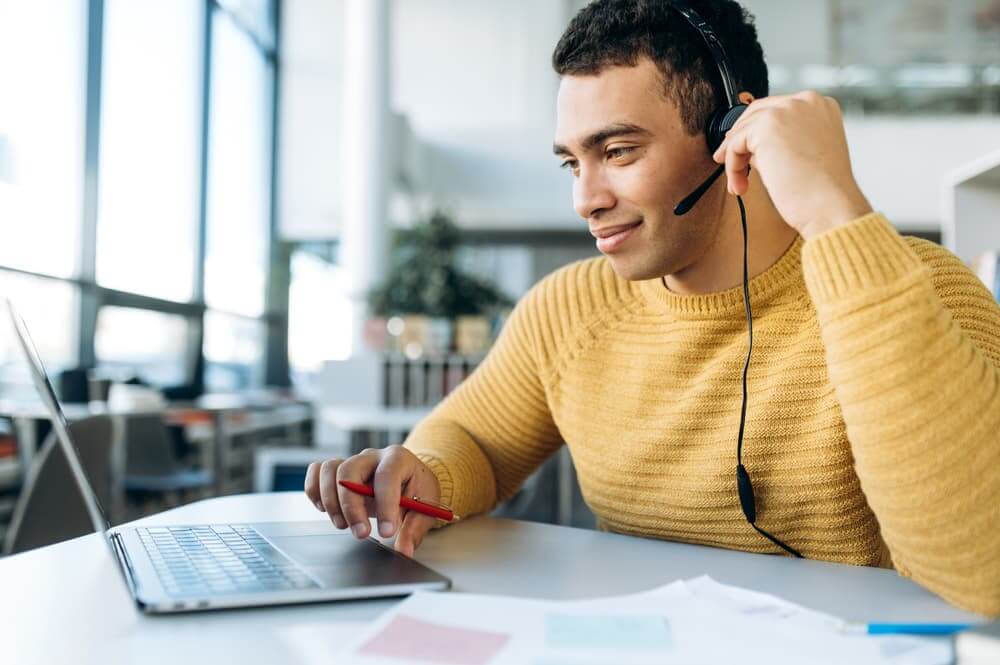 Outsourcing support working on a laptop
