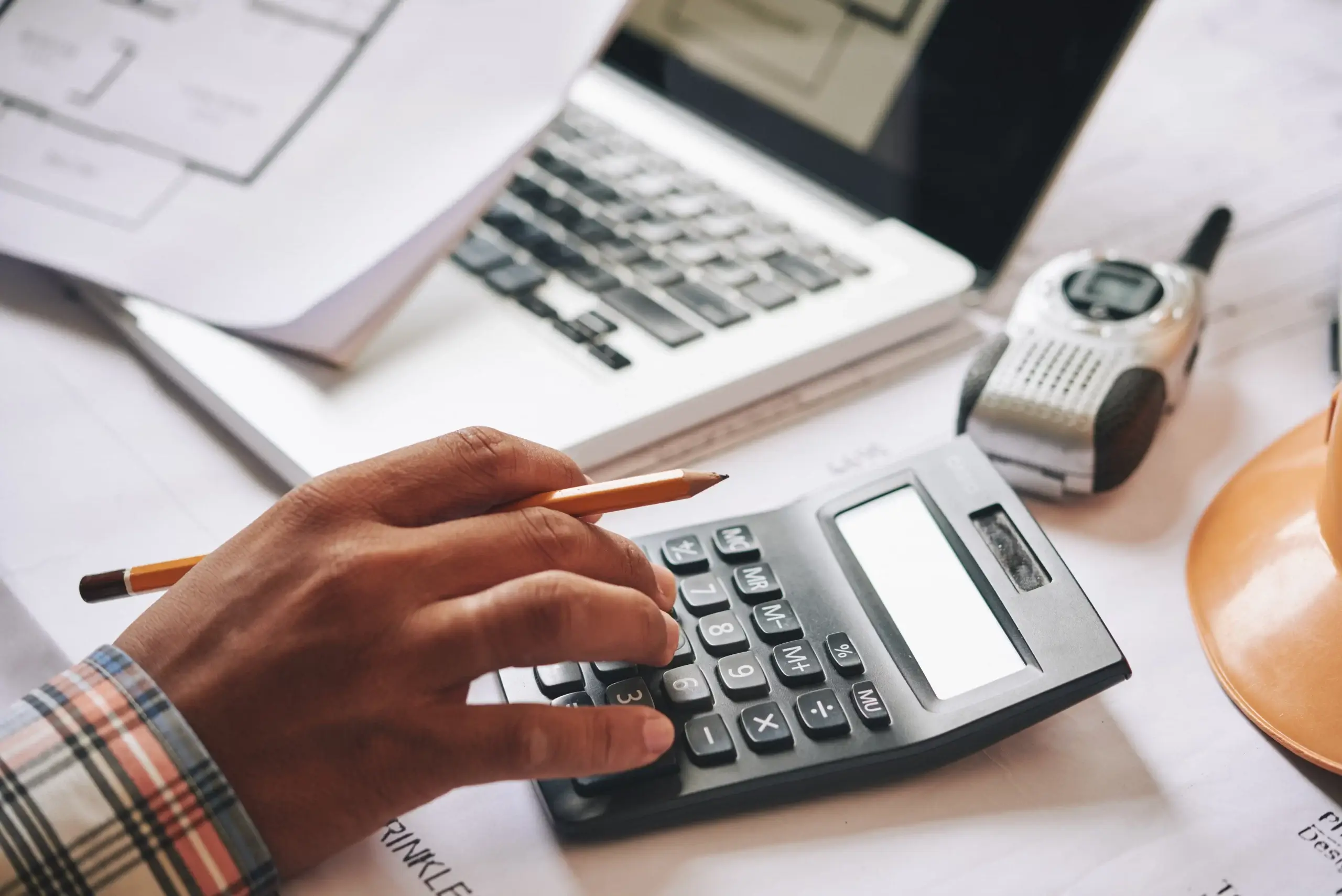 worker of ourtsourced construction estimating services performing an estimate