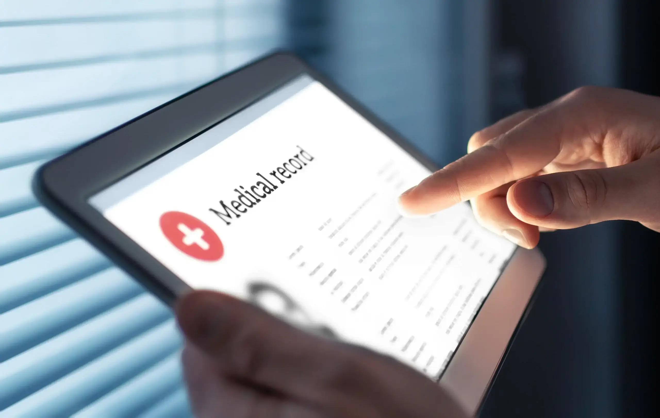 rep from outsourcing medical records company reviewing a medical record