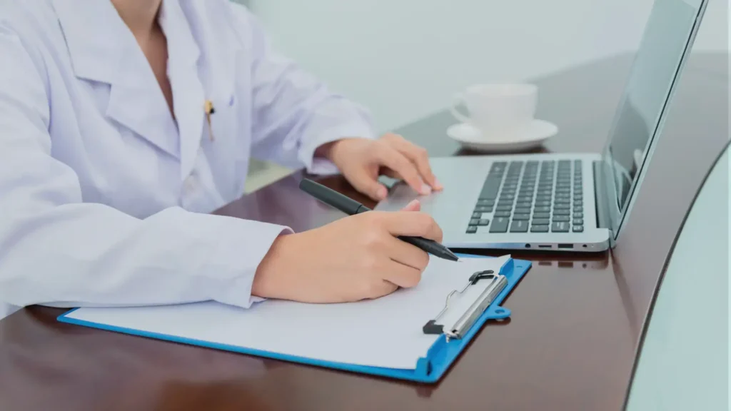 medical records outsourcing company representative working on a medical record