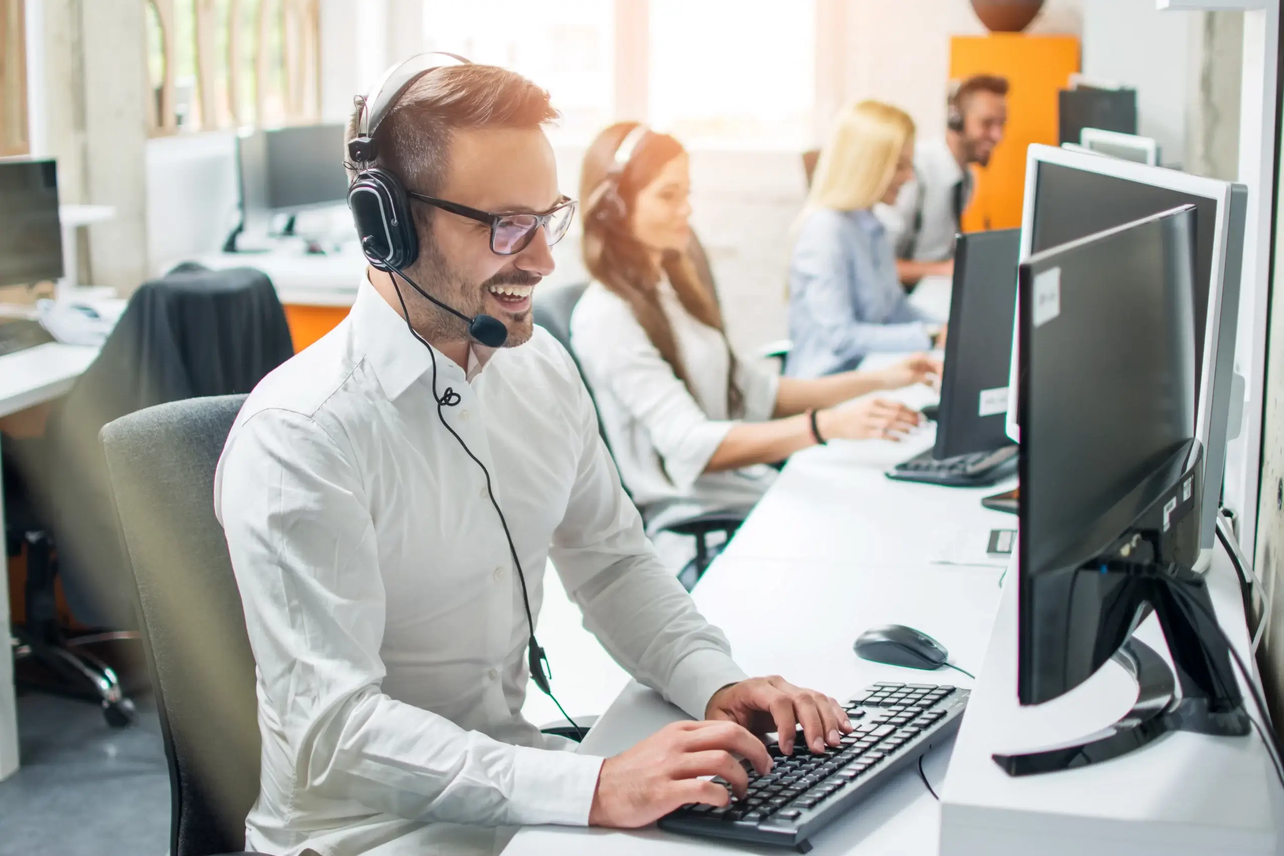 representative on computer who works for one of the best appointment setting companies