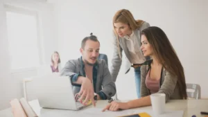 A group of colleagues communicating to each other to solve an issue