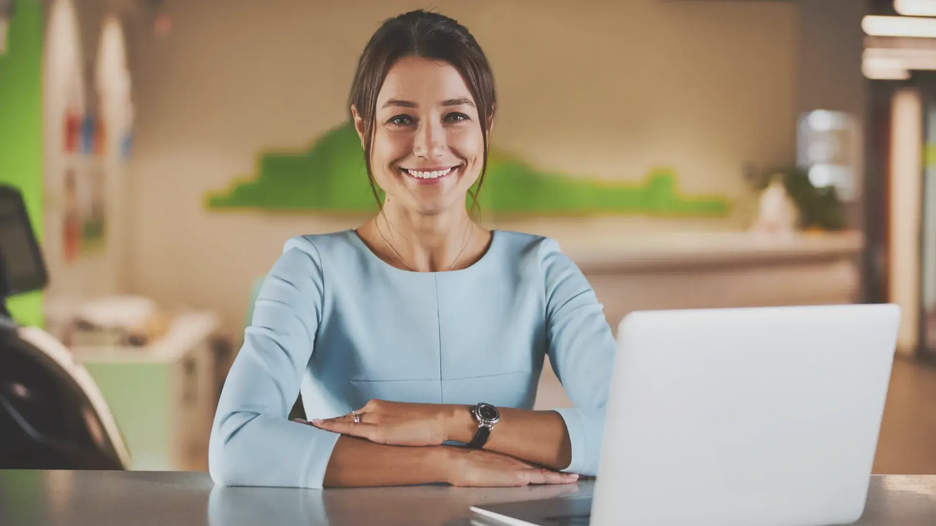 a happy woman who just hired a pinterest virtual assistant to manage their pinterest account