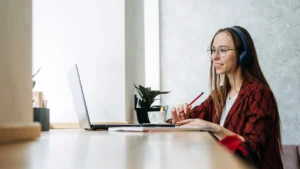 an outsourced appointment setter onboarding with a new company virtually via her laptop