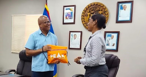 Representatives from Peak Outsourcing International BLZ LTD. and Belize City Council signing a memorandum of understanding