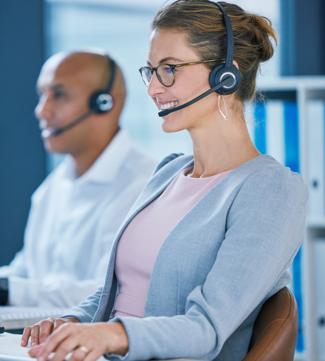 A customer service representative talking through a the microphone