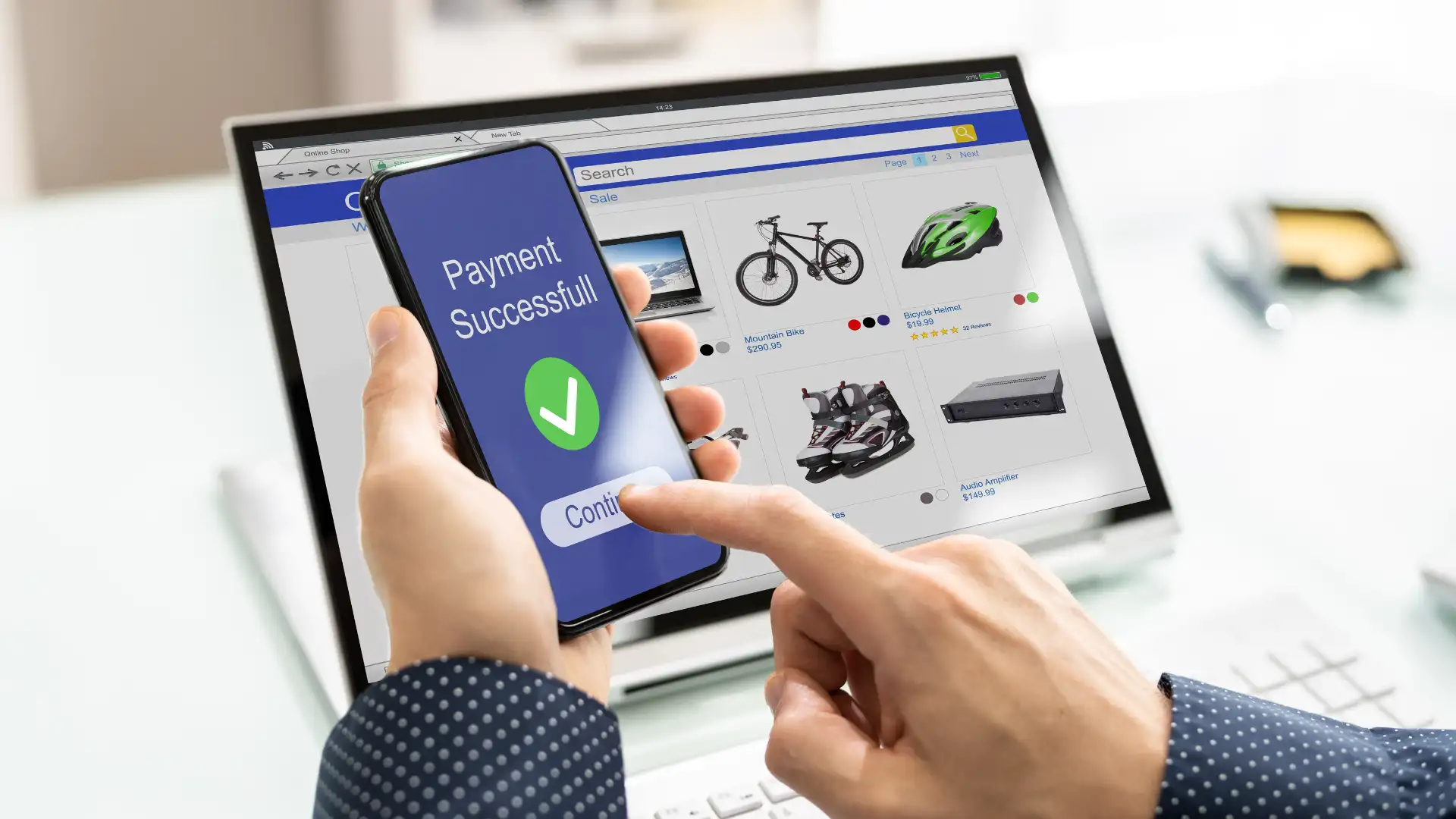 Person completing an online payment on a smartphone while shopping on a laptop, highlighting e-commerce fulfillment challenges.
