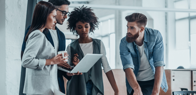 A group of professionals collaborating in an office setting