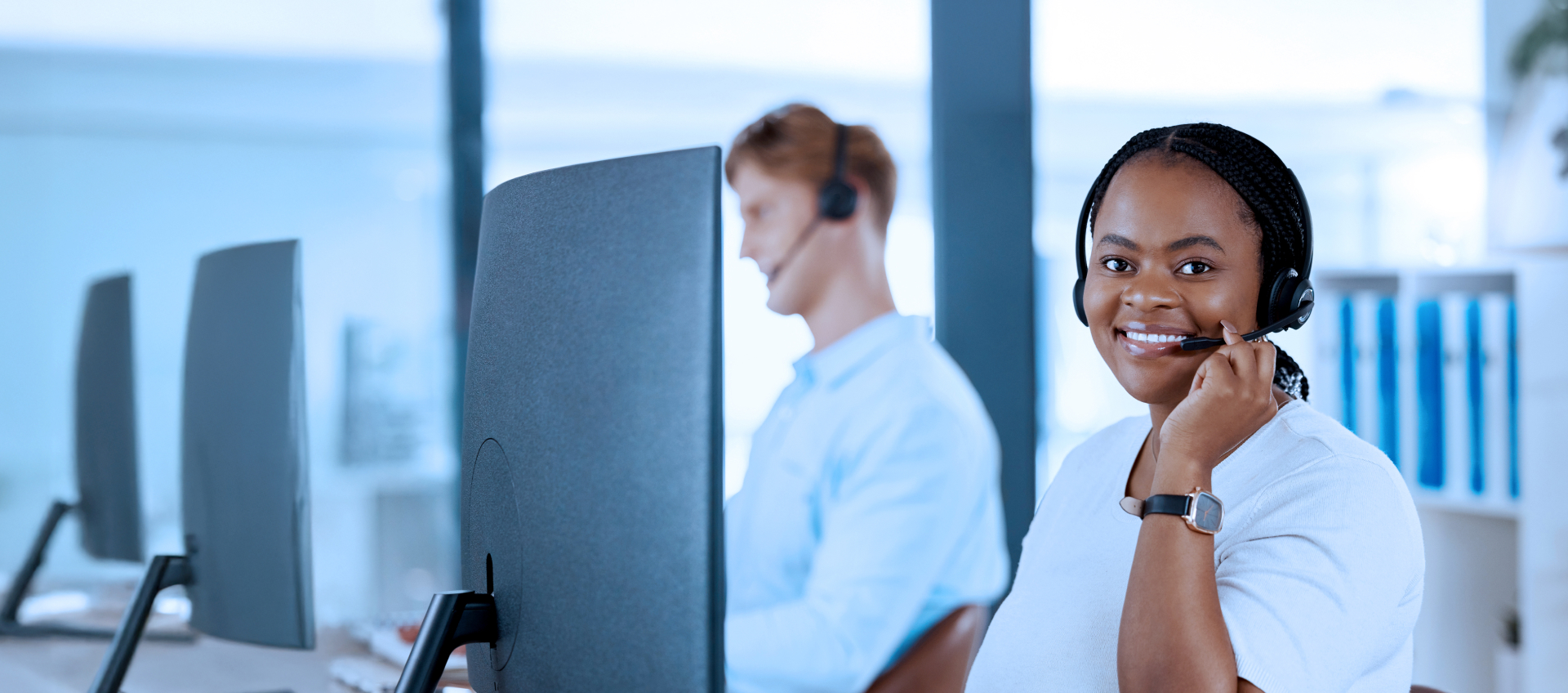 Two individuals working on their computers