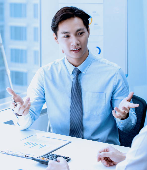 Professional explaining financial reports during a meeting.