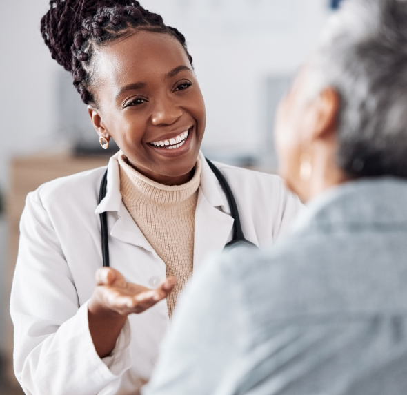 Smiling healthcare professional talking to a patient