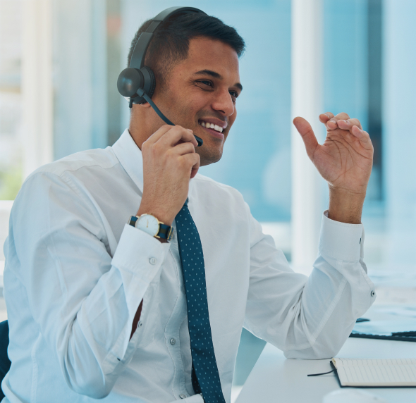 Smiling professional wearing a headset, engaged in a conversation