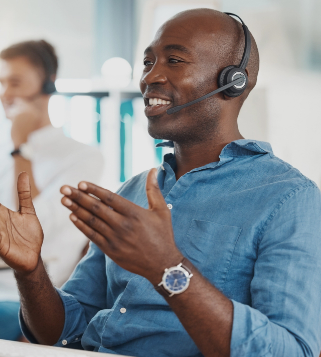 An employee talking to a customer through the microphone
