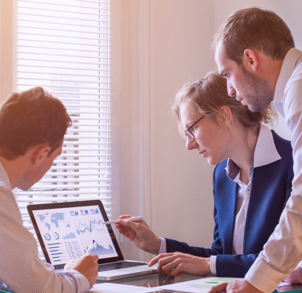 Individuals who are looking at the screen while one explains