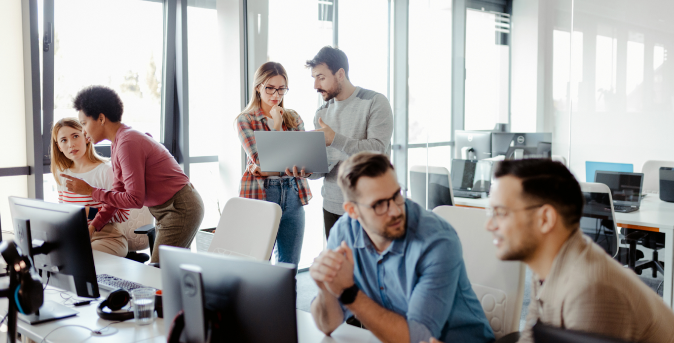 team of outsourcing experts discussing a project