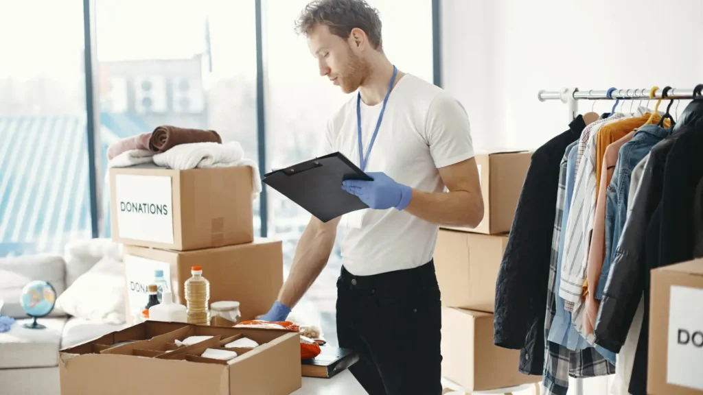 Worker checking boxes and taking notes on clipboard