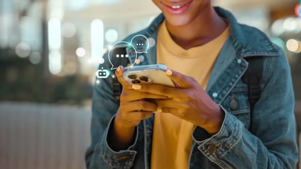 Person smiling while texting on smartphone
