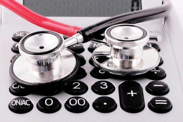 Calculator with a stethoscope on top