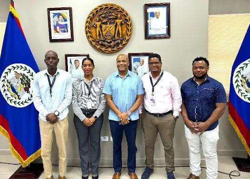 Representatives from Peak Outsourcing International BLZ LTD. and Belize City Council signing a memorandum of understanding
