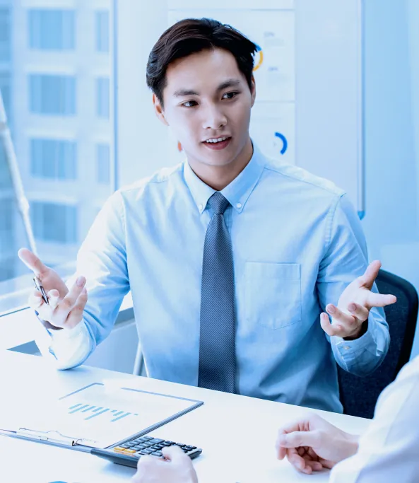 Professional explaining financial reports during a meeting.