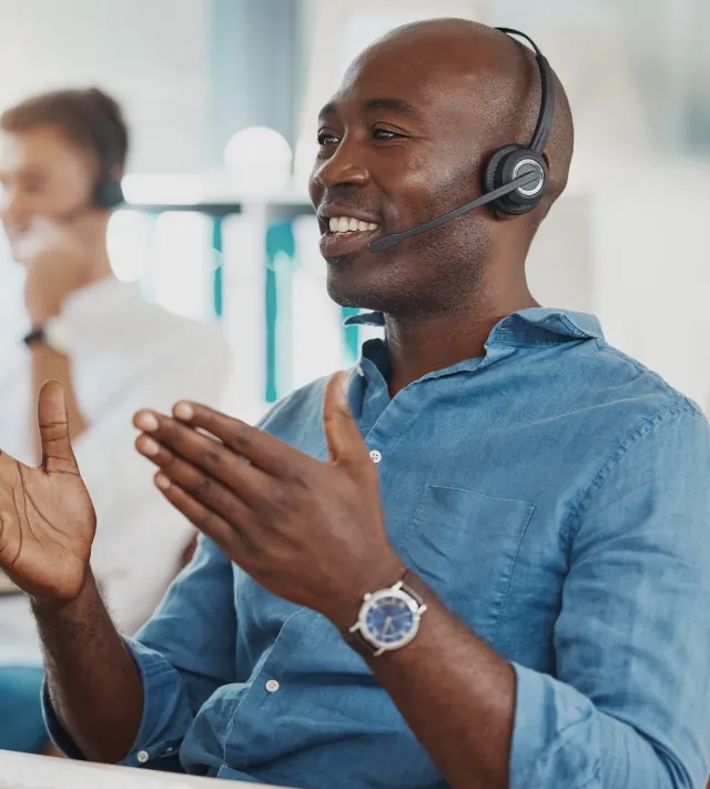 An employee talking to a customer through the microphone